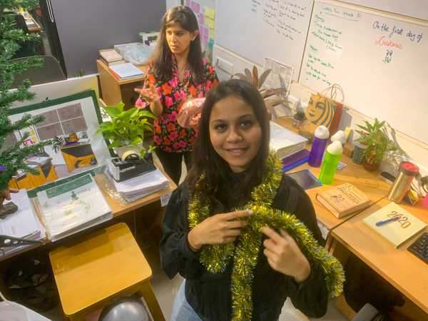 Top shot of two slangbusters carrying christmas decorations
